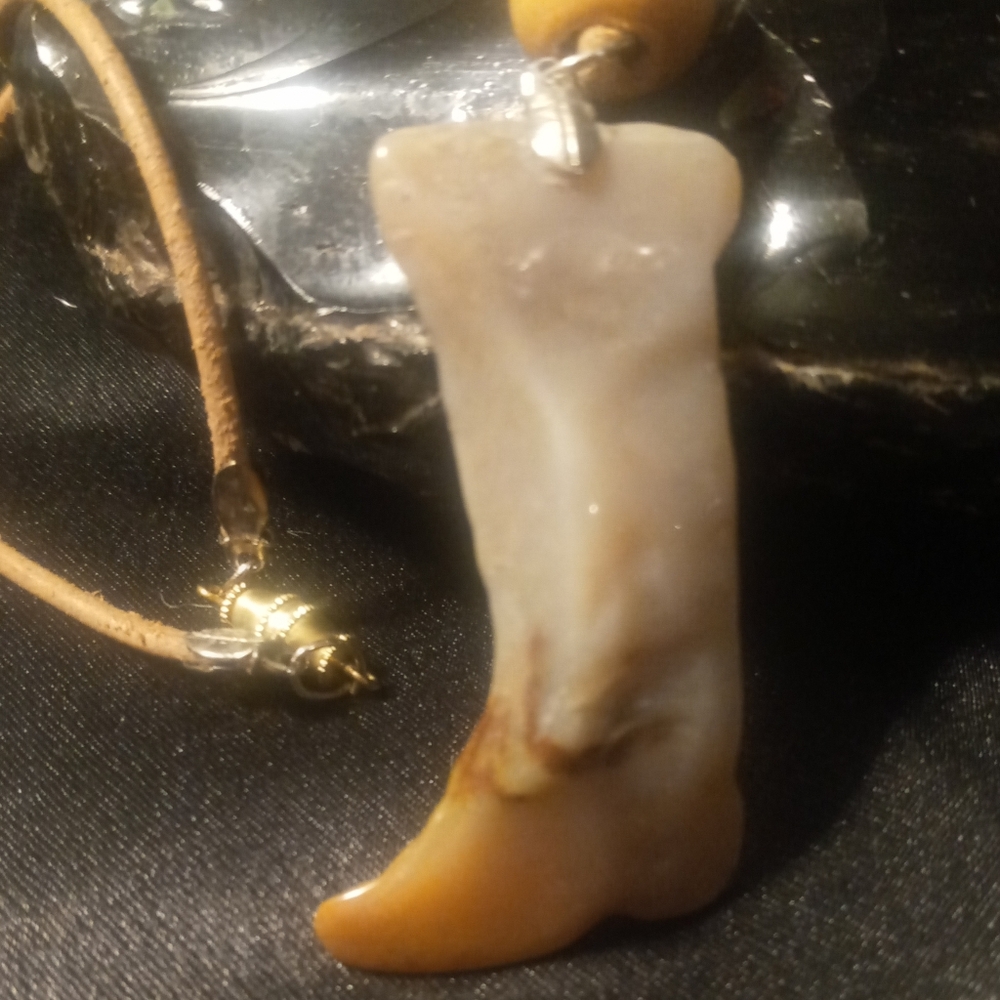 Nephrite Jade boot on a leather cord with a thumb clasp. Hand crafted